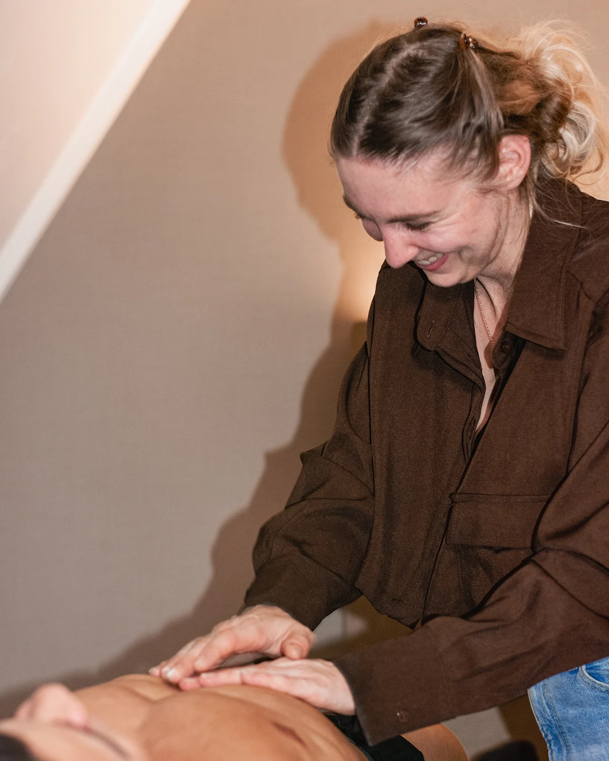 Sylvana at work on an athlete during a treatment.